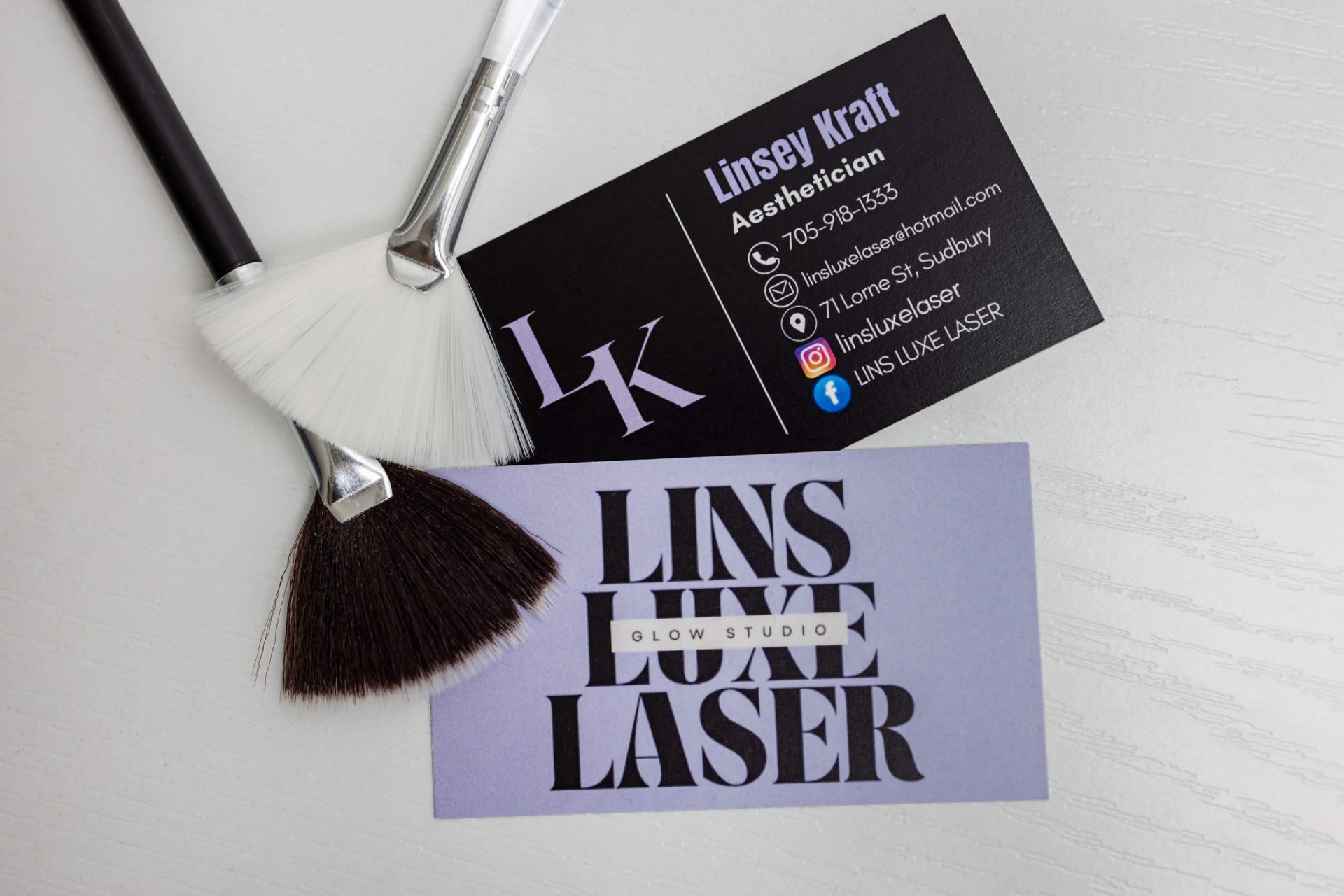 Lins Luxe Laser branding with aesthetician brushes